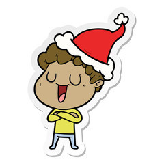 laughing sticker cartoon of a man wearing santa hat