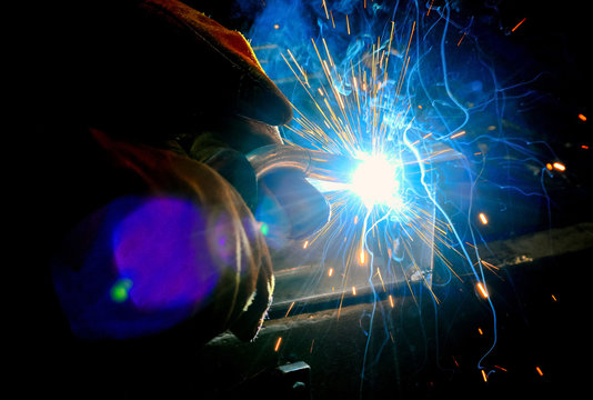 moment of contact of the electrode to the metal electric welding with sparks