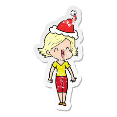distressed sticker cartoon of a happy woman wearing santa hat
