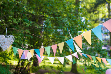 colorful flag festival celebrate in garden. Beautiful colour flag triangle.