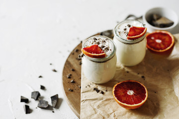 Fresh, natural, homemade yogurt with chocolate and blood orange.Overhead view.
