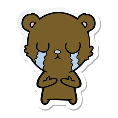sticker of a crying cartoon bear
