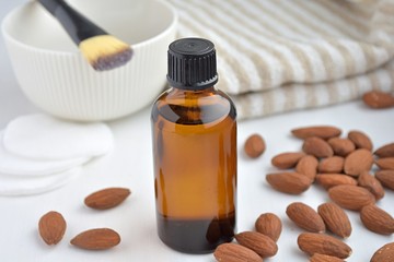 Natural almond oil for homemade cosmetics, close up view.