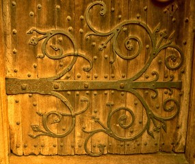 A hand forged historic hinge at a chapel