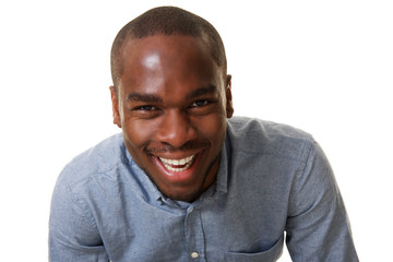 Close up laughing african american man against isolated white background