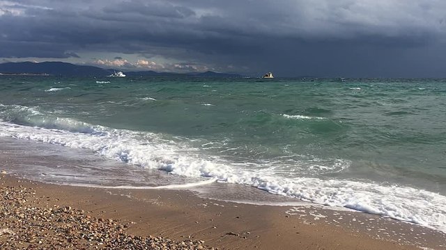 Fishing boats in the stormy sea.