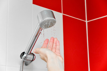 Water supply problems in the city. Taking a shower water