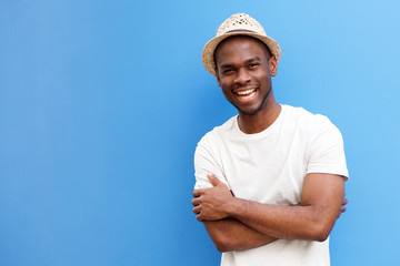 african american man smiling against blue background