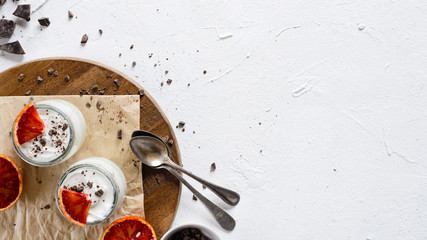 Fresh, natural, homemade yogurt with chocolate and blood orange.Overhead view.