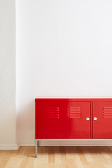 red locker white wall wooden floor in vivid light