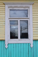 Fototapeta premium Russian wooden traditional window frame. Old dirty wall wooden texture.