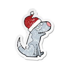 retro distressed sticker of a cartoon dog wearing christmas hat