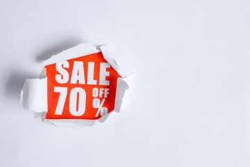 The concept of sales in the form of discounts 70. The inscription on the red paper coming out of...