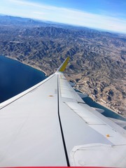 Fototapeta na wymiar jet wing over coast