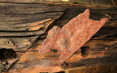 Weathered wood with rusty iron brackets