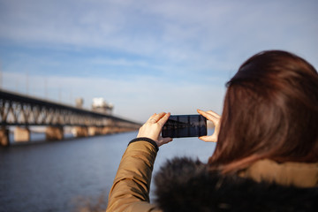 Kiev, Ukraine - March 01, 2019: Brand new Samsung Galaxy S10. Girl taking photo.