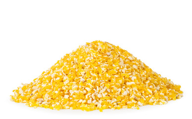 Heap of corn groats close-up on a white. Isolated.