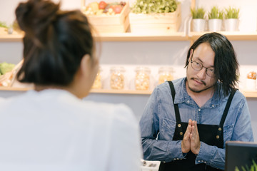 customer select and choose some food order to waiter at bar