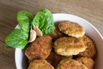 Tasty roasted meat on plate with garlic and salat
