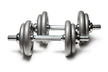 Metal dumbbells for fitness with chrome silver handle isolated on white