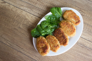Fried beef cutlet with fork on the plate