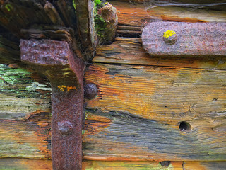 Weathered wood with rusty iron brackets