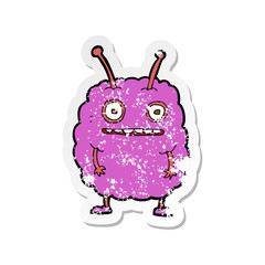 retro distressed sticker of a cartoon funny alien monster