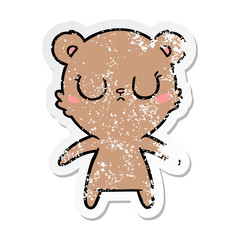 distressed sticker of a peaceful cartoon bear cub