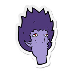 sticker of a cartoon vampire face