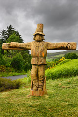 Carved wood life size Tattie Bogle Scarecrow previously pointing to the Tattie Bogal trail on Carbost Road Drynoch Isle of Skye Scotland UK