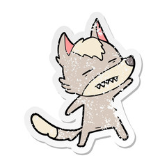 distressed sticker of a cartoon wolf showing teeth
