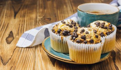 Freshly baked muffins with blueberry on the table.