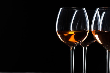 Glasses of wine in darkness