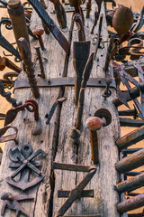 various iron objects stuck in wood