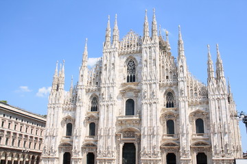 Fototapeta premium The amazing Milan Cathedral, Duomo di Milano, the largest Gothic cathedral in the world and Vittorio Emanuele gallery in Square Piazza Duomo, Italy