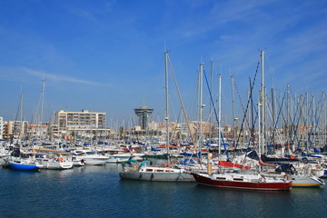 Fototapeta premium Marina and the lighthouse of the Mediterranean, an ancient water tower in Palavas les flots, a seaside resort of the Languedoc coast in the south of Montpellier