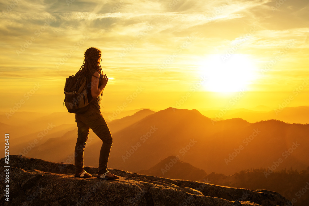 Poster hiker meets the sunset on the moro rock in sequoia national park, california, usa.