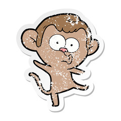 Obraz na płótnie Canvas distressed sticker of a cartoon surprised monkey
