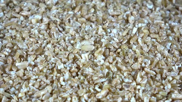 Dehydrated freekeh roasted green wheat grains spinning video