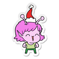 sticker cartoon of a alien girl laughing wearing santa hat