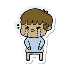 sticker of a cartoon boy crying