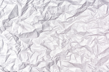 Texture of heavily crumpled gray paper. Empty background.
