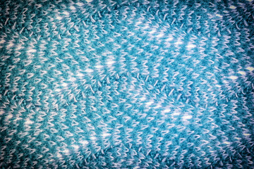 Wool dark blue fabric close up. Background with knitted texture, wave pattern.