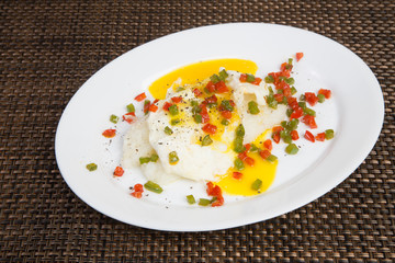 Grits and Eggs Over Easy with Colorful Spices for Brunch