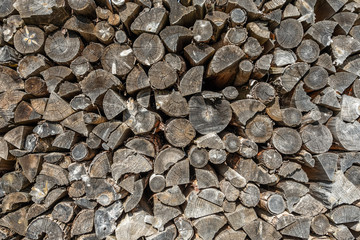 Chopped firewood in woodpile winter