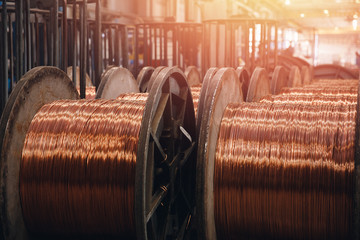 Production of copper wire, bronze cable in reels at factory - obrazy, fototapety, plakaty