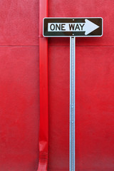 One Way Sign And Gutter