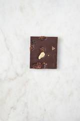 Chocolate on a white marble board.