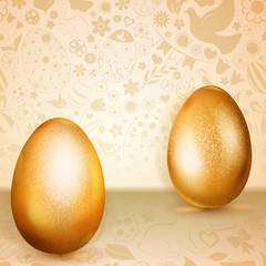 Two golden Easter eggs standing on background of flowers, cakes, hare, chicken and other holiday symbols