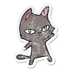 distressed sticker of a cartoon cat staring